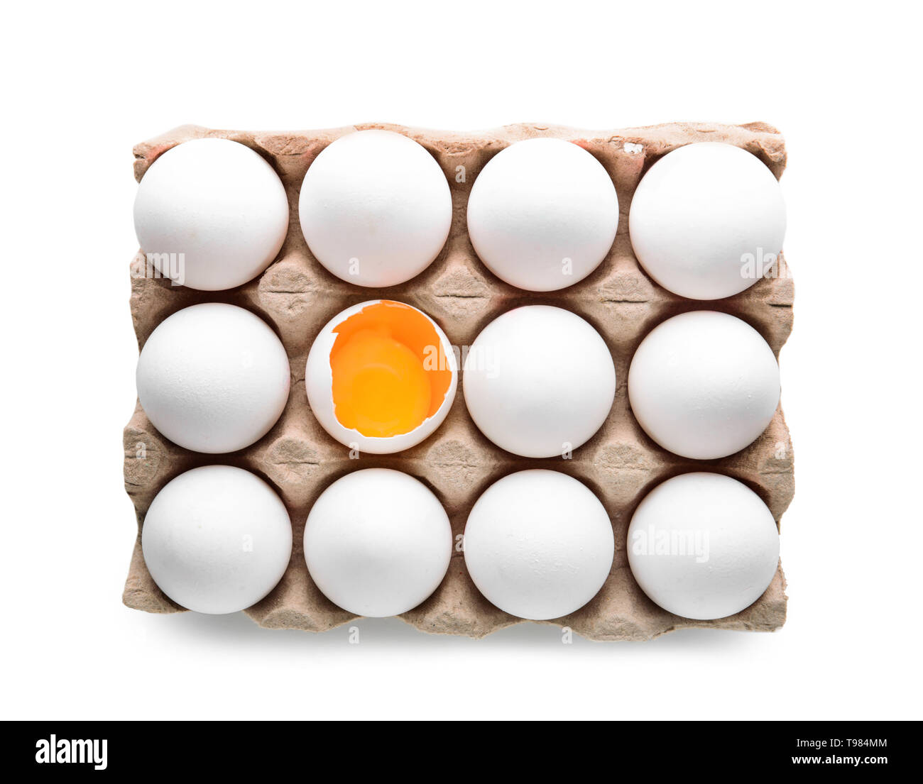 Carton pack with cracked and whole chicken eggs on white background ...