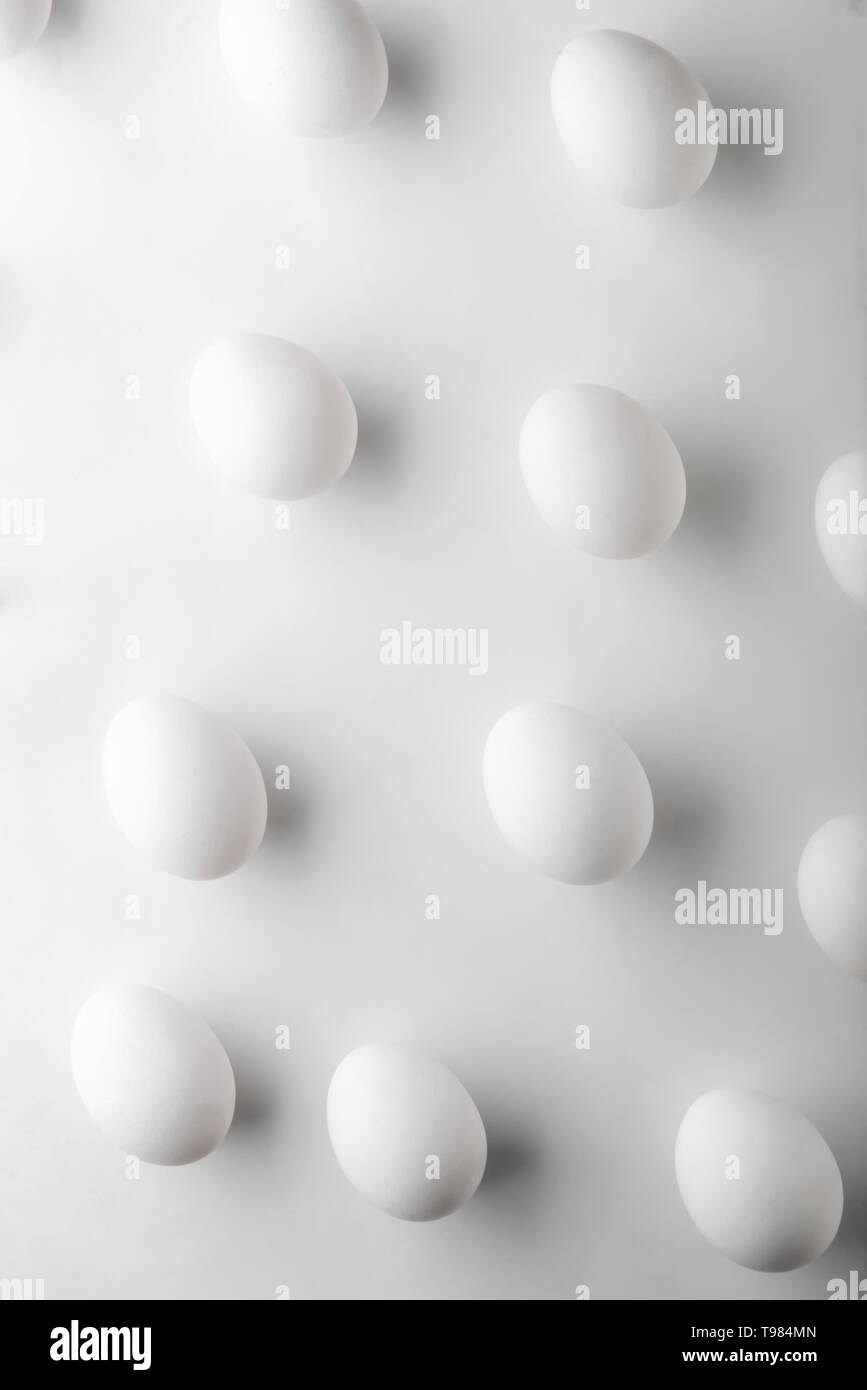 Raw chicken eggs on white background Stock Photo - Alamy