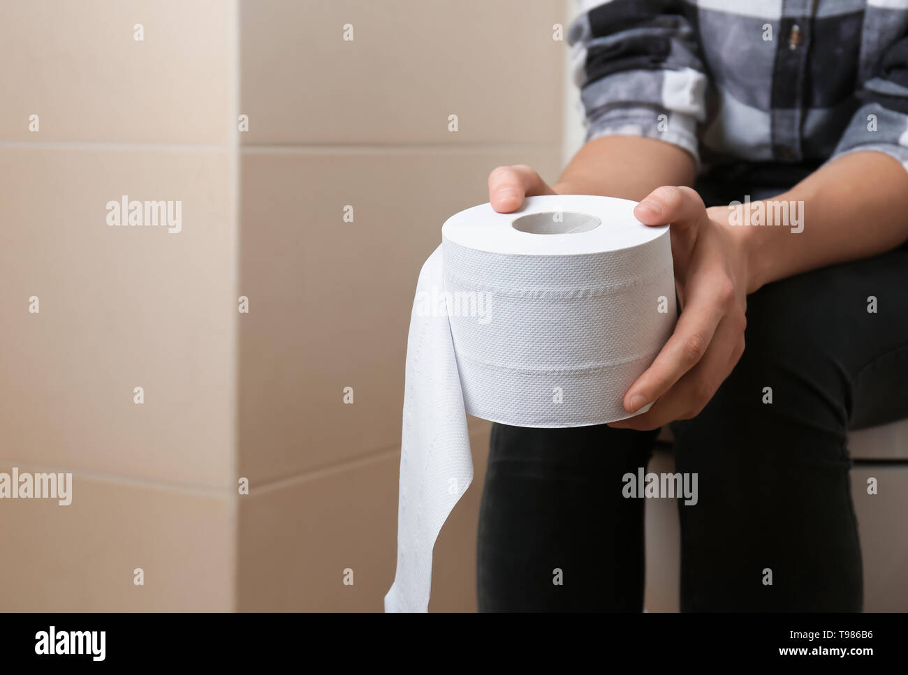 Sitting on loo female hi-res stock photography and images - Alamy