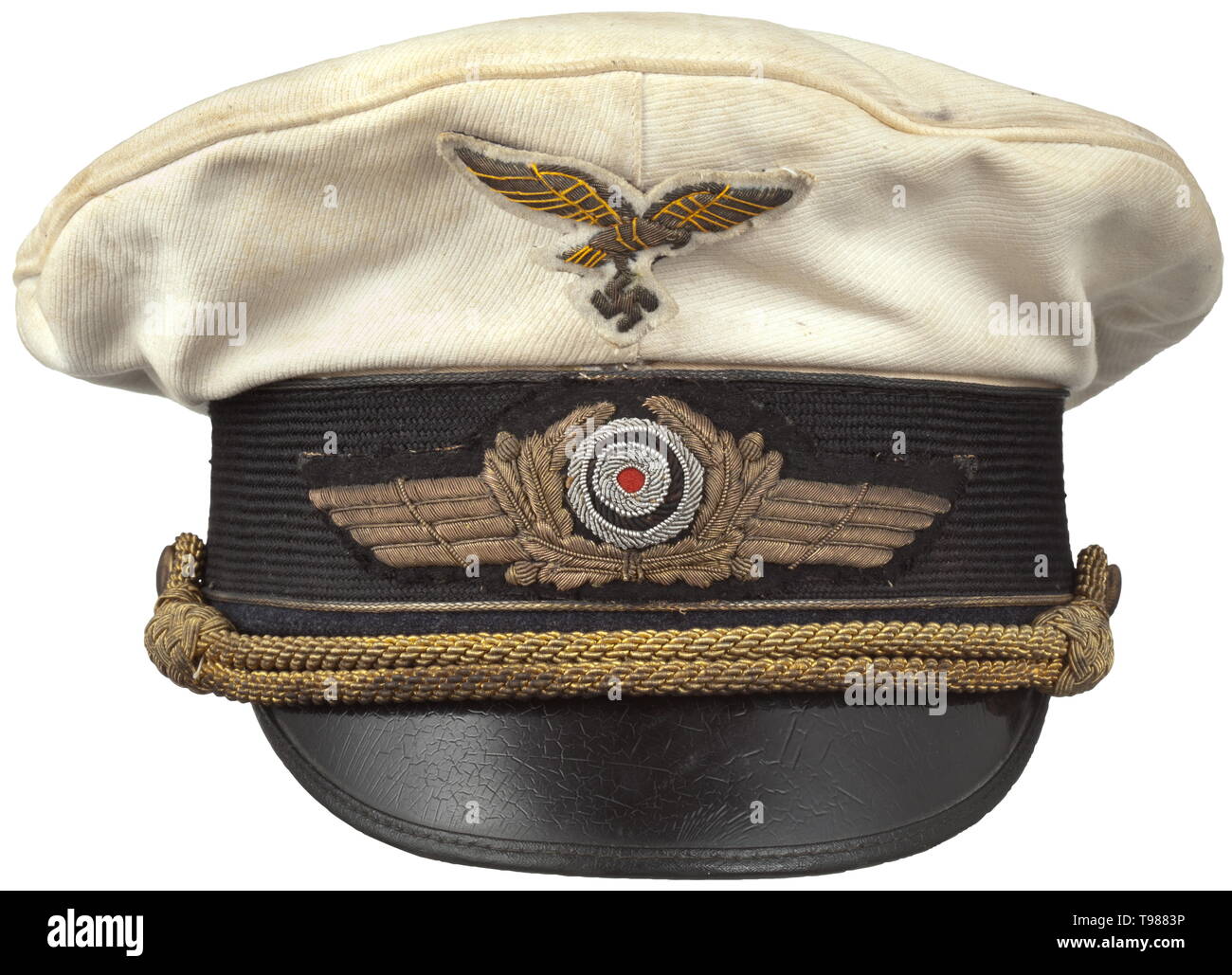 A visor cap for a general of the Luftwaffe in the white summer issue The cap cover of white linen, black mohair trim band, the lower cap edge of Luftwaffe-blue cloth with gold general's braid, white silk liner, the cap trapezoid with silver imprint 'Deutsche Facharbeit', light brown leather sweatband, hand embroidered cap insignia (the eagle changeable on a metal base), gold cap cording. A lightly used visor cap. historic, historical, Air Force, branch of service, branches of service, armed service, armed services, military, militaria, air forces, object, objects, stills, c, Editorial-Use-Only Stock Photo