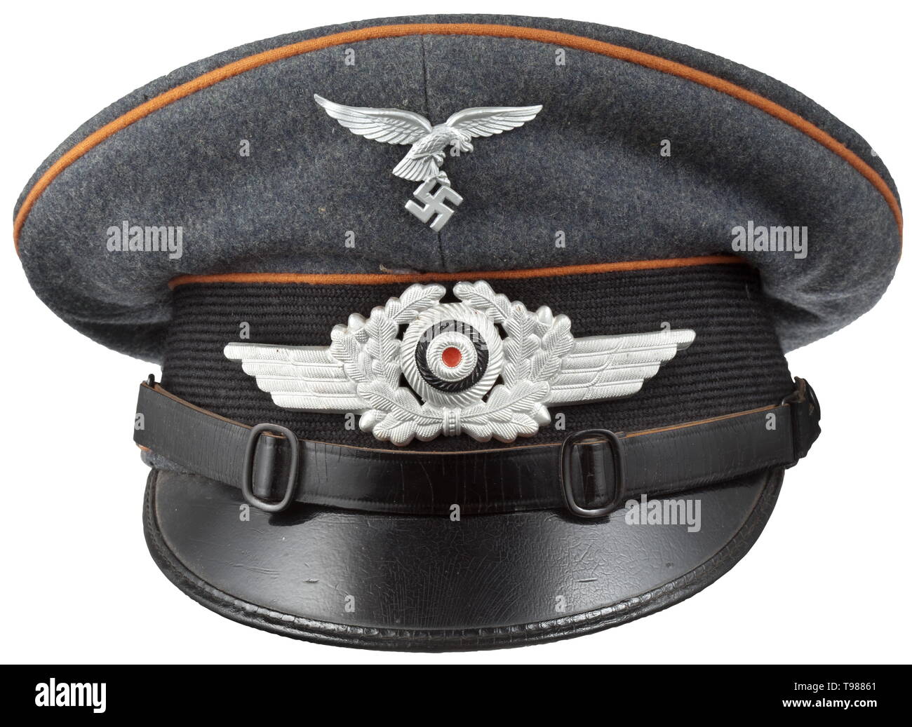 A visor cap for enlisted men/NCOs of air signals troops depot piece of Bomber Wing 27 'Boelke' Luftwaffe-blue woollen cloth, trim band of black mohair, copper-brown piping, beige inner liner with cap trapezoid of maker '1937 Bundeslieferungs Genossenschaft des Mützenmacherhandwerks Niedersachsen', brown leather sweatband stamped inside '1937 II/Boelcke Fl.H.K.Wunstorf' (air base command for the 2nd group of the bomber wing in Wunstorf), visor with green underlay, early aluminium insignia, black patent leather straps. historic, historical, Air Force, branch of service, branc, Editorial-Use-Only Stock Photo