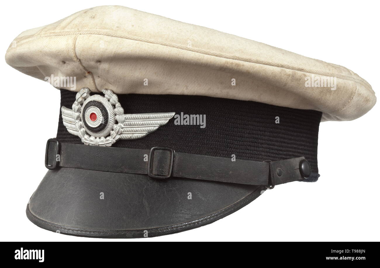 A visor cap of the German air sports association in the white summer issue Changeable cover in white linen, trim band of black mohair, the lower cap edge of blue-grey woollen cloth, brown leather sweatband, aluminium cap wings. historic, historical, Air Force, branch of service, branches of service, armed service, armed services, military, militaria, air forces, object, objects, stills, clipping, clippings, cut out, cut-out, cut-outs, 20th century, Editorial-Use-Only Stock Photo