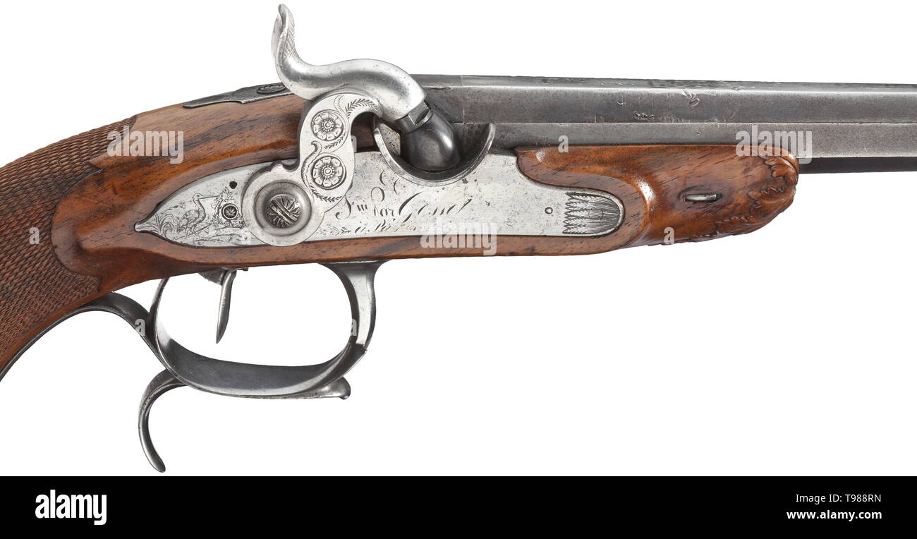 A percussion pistol, Gosset, Paris, circa 1830 Lightly swamped octagonal barrel with patent breechblock and hair-rifled bore in 12 mm calibre. Silver-inlaid signature 'FNI PAR GOSSET A PARIS' on barrel rib. Engraved percussion lock with back trigger and repeated signature (rubbed). Carved walnut stock with engraved iron mounting. Iron parts somewhat pitted in places, barrel somewhat dented. Length 41 cm. Louis Marin Gosset worked in Paris between 1822 - 1840, from 1793 - 1813 he was assistant to Nicolas Boutet. historic, historical, gun, guns, fi, Additional-Rights-Clearance-Info-Not-Available Stock Photo