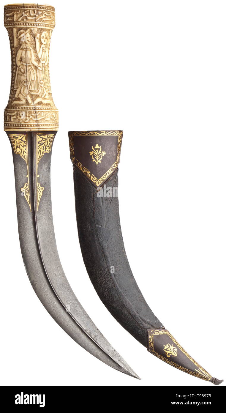 A Persian gold-inlaid khanjar, dated 1786 Blade made of dark-coloured wootz Damascus with beautiful grain pattern, with a medial rib on both sides. Floral gold inlays on both sides of the base. Massive walrus ivory grip carved with figures and Persian inscriptions, the translation of which reads: (tr.) 'Even if it is merely a handful of bones, the grip of your dagger can conquer the world' and 'The affairs of the world will not be put to rights until your foot has stepped inside'. Dated '1200' (= 1786). Wooden scabbard covered with shagreen leath, Additional-Rights-Clearance-Info-Not-Available Stock Photo