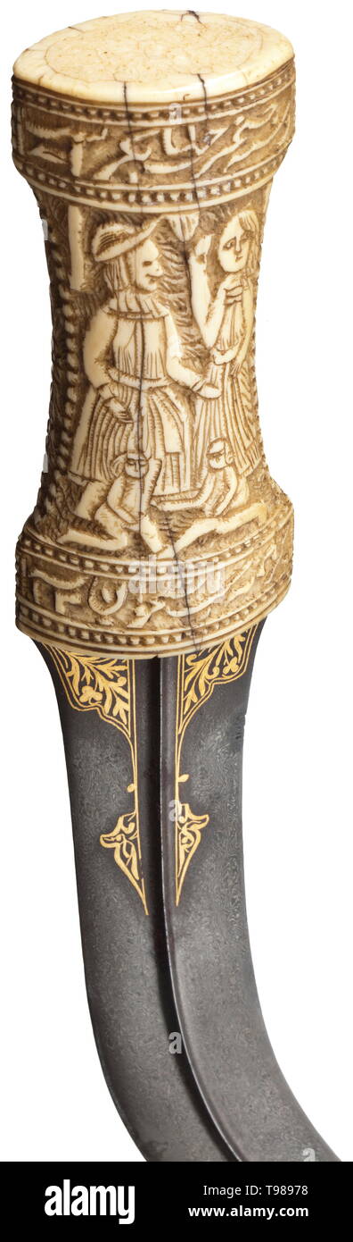 A Persian gold-inlaid khanjar, dated 1786 Blade made of dark-coloured wootz Damascus with beautiful grain pattern, with a medial rib on both sides. Floral gold inlays on both sides of the base. Massive walrus ivory grip carved with figures and Persian inscriptions, the translation of which reads: (tr.) 'Even if it is merely a handful of bones, the grip of your dagger can conquer the world' and 'The affairs of the world will not be put to rights until your foot has stepped inside'. Dated '1200' (= 1786). Wooden scabbard covered with shagreen leath, Additional-Rights-Clearance-Info-Not-Available Stock Photo