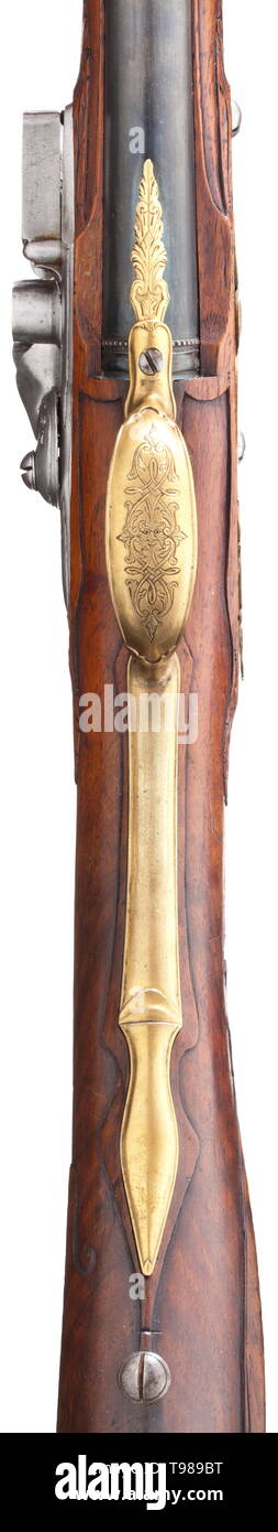A German flintlock rifle/shotgun combination, circa 1730 Newly blued, over-and-under round barrels with an eight-groove rifled bore and a smooth bore in 13 mm calibre with silver front sight on the upper side. The rifle barrel decorated with ornamental silver inlays and standing male figure. Florally engraved flintlock with movable powder pan chiselled on the side in the shape of a monster. Monogram 'IVB' between the arms of the frizzen spring. Carved walnut full stock with horn nose and finely chiselled brass furniture. The openwork side plate w, Additional-Rights-Clearance-Info-Not-Available Stock Photo