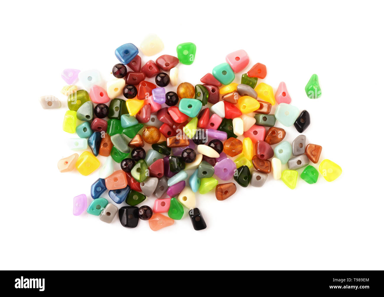 Colorful beads. Glass, seed beads and felted beads for jewelry making on white background. Hobby, handmade, fine arts. Stock Photo