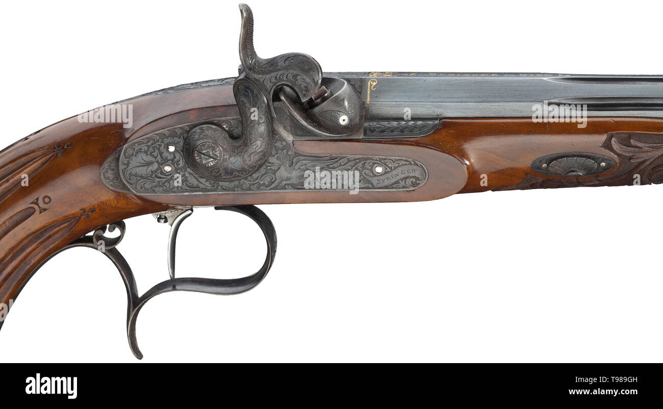 A cased pair of percussion pistols, Johann Springer in Vienna, circa 1850 Octagonal barrels with fluted middle section and original burnishing. Rifled bores in 9 mm calibre. Dovetailed, blued front sights, adjustable rear sights. The breeches with gold-inlaid signature 'J. Springer in Wien', the roots of the barrels decorated with gold-inlaid arabesques. The snails and tangs with deeply chiselled acanthus decoration. Barrels and tangs numbered '1' and '2', respectively. Locks decorated with fine, deeply etched tendrils and mythical creatures as w, Additional-Rights-Clearance-Info-Not-Available Stock Photo