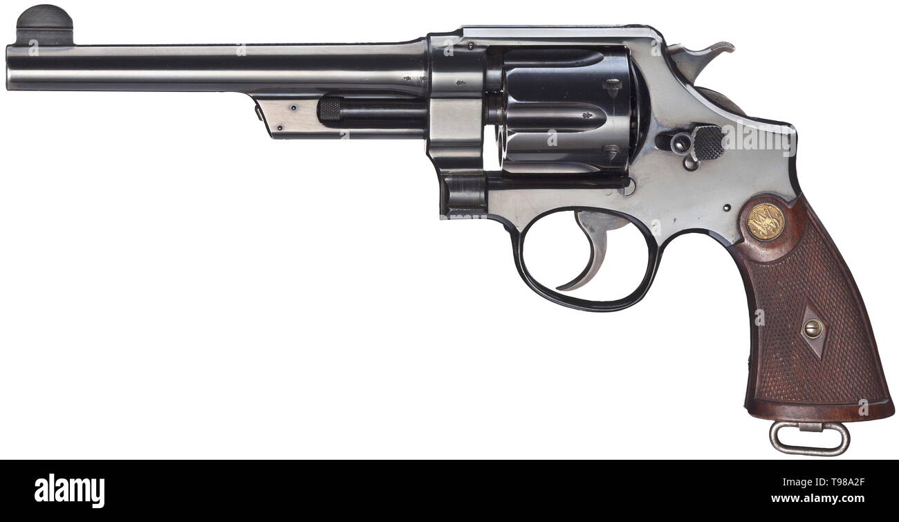 A Smith & Wesson .44 Hand Ejector 1st Model (Triple Lock), circa 1908 Cal..44 S & W Spl.(?), no. 5428. Matching numbers. Bright bore, length 6-1/2'. Six shots. British civilian proof mark. On barrel two-line company name and patents. Complete, original, blue-black highly polished finish with minimal signs of usage at barrel front and on back strap. Colour case-hardened hammer and trigger. Dark walnut grip panels with both medallions. Lanyard loop. A rare top item in as new - new condition. Erwerbsscheinpflichtig. historic, historical, civil handg, Additional-Rights-Clearance-Info-Not-Available Stock Photo