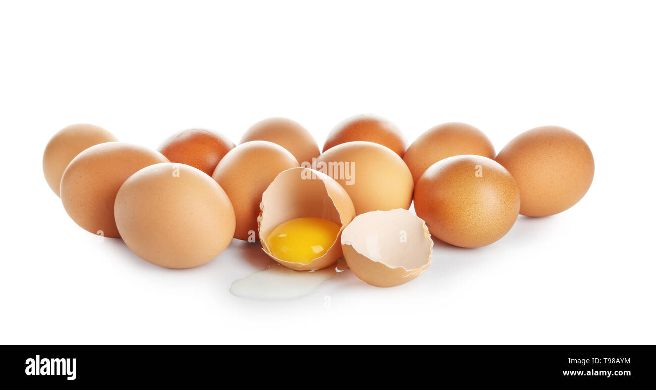 Cracked and whole chicken eggs on white background Stock Photo - Alamy