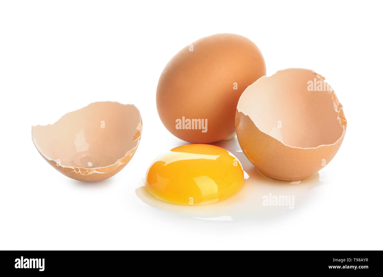 Cracked and whole chicken eggs on white background Stock Photo - Alamy