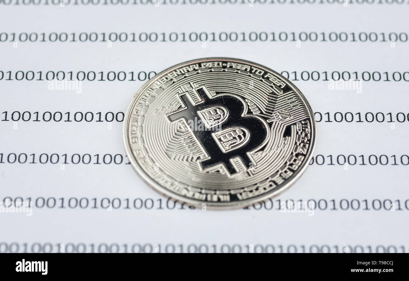 Bitcoin Cryptocurrency Physical Coin On Paper With Binary System Of Zeros And Ones Virtual Cryptocurrency Concept Concept Image For Cryptocurrency Stock Photo Alamy