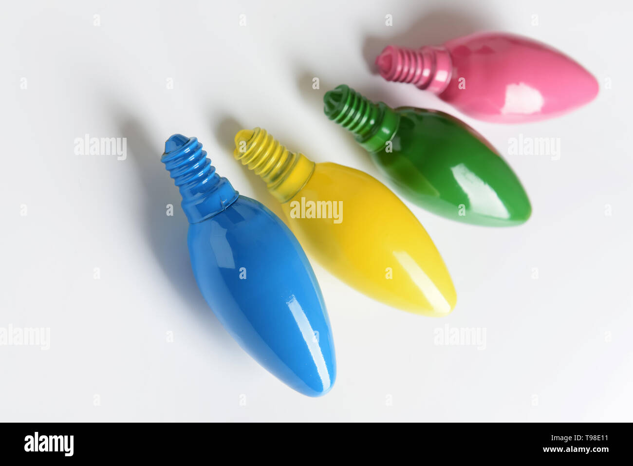 Painted light bulbs on white background Stock Photo