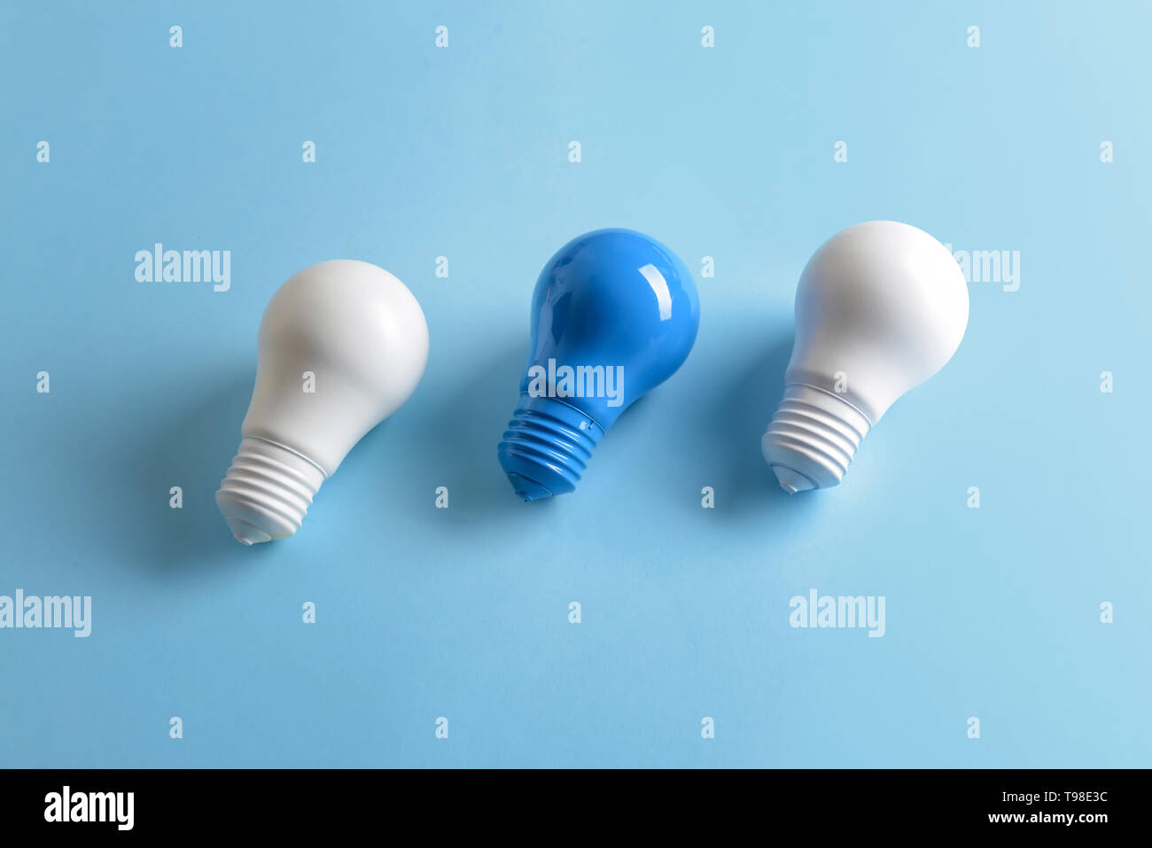 Painted light bulbs on color background Stock Photo