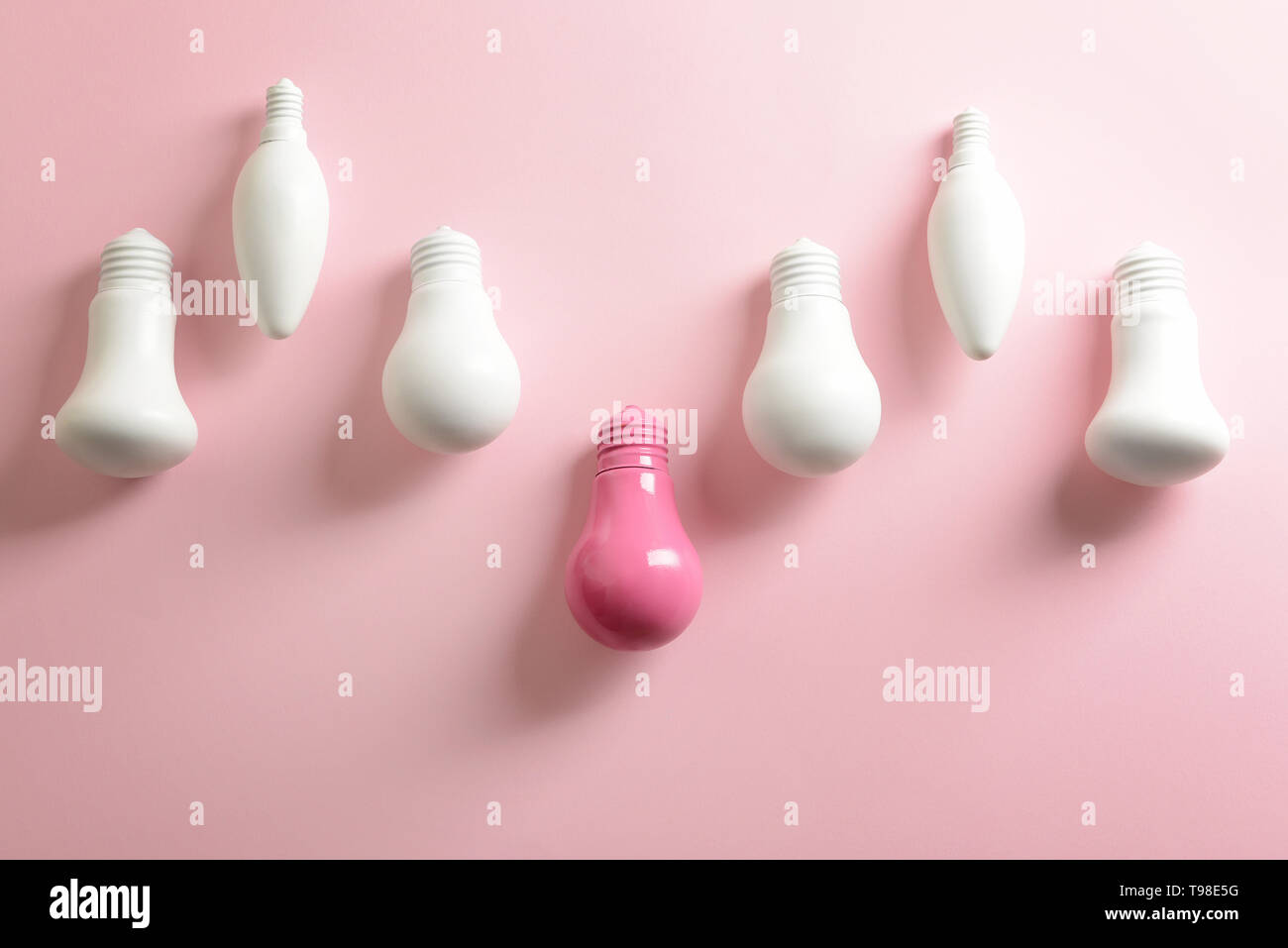 Painted light bulbs on color background Stock Photo