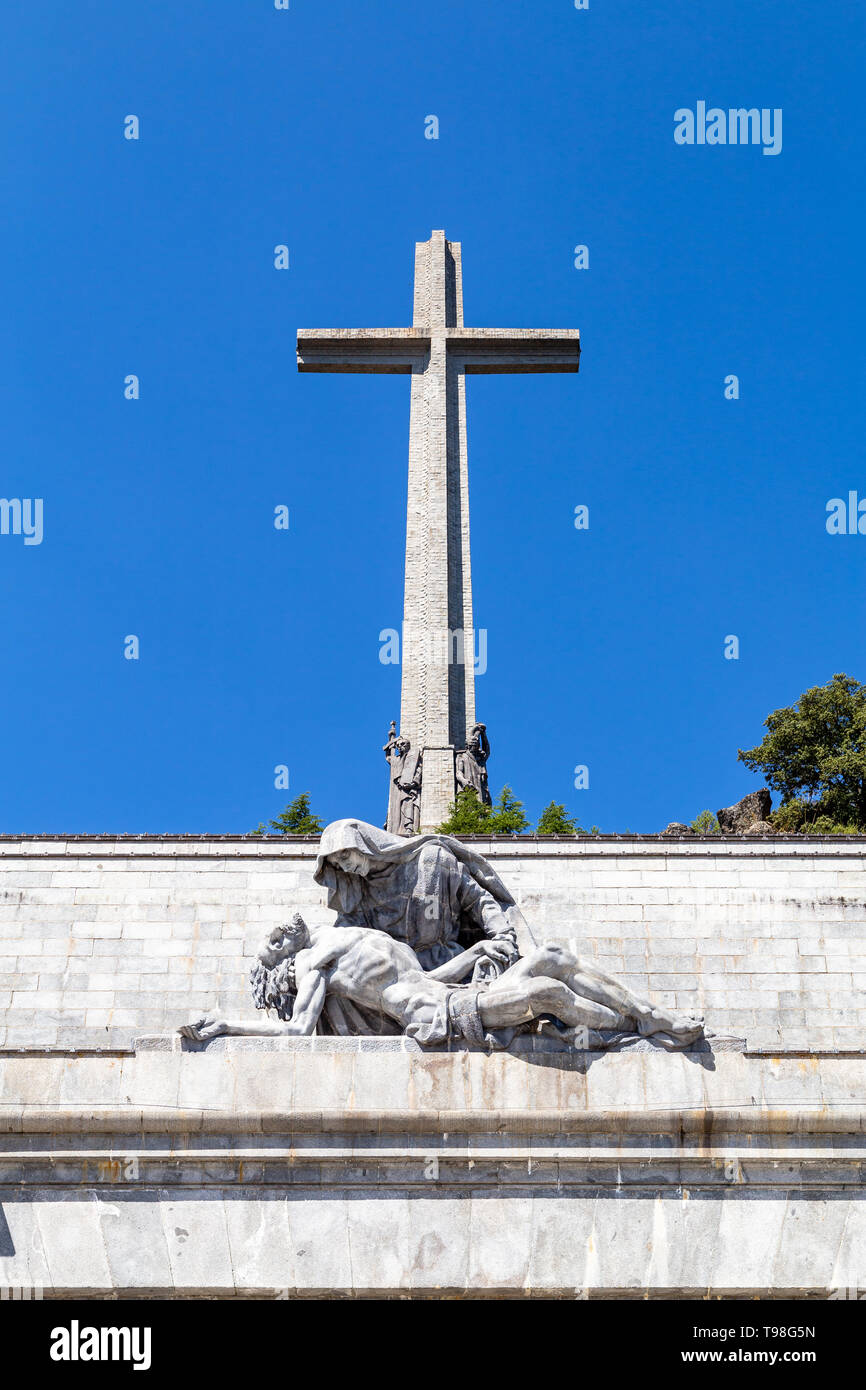 The passion of Christ statue and the big cross on the top of the Valley of the Fallen, Valle de Los Caidos , the burying place of the Dictator Franco  Stock Photo