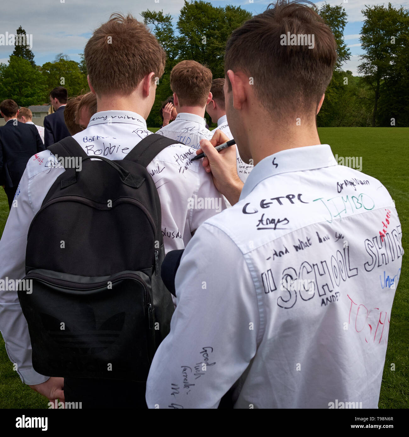 Leeds, Yorkshire / UK - May 17th 2019: School leavers sign shirts on the last day of education Stock Photo