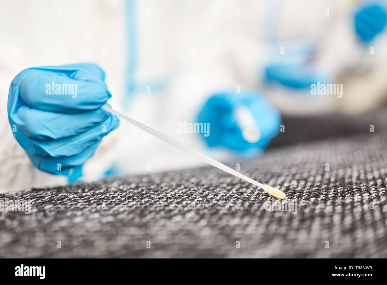 Recording of DNA sample at crime scene by forensic police Stock Photo