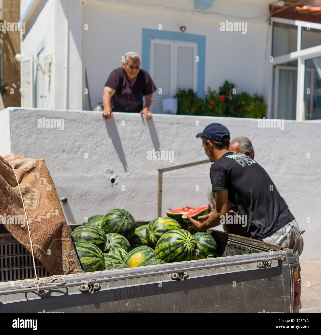 Greek farmers selling melons from the van to villager village resident