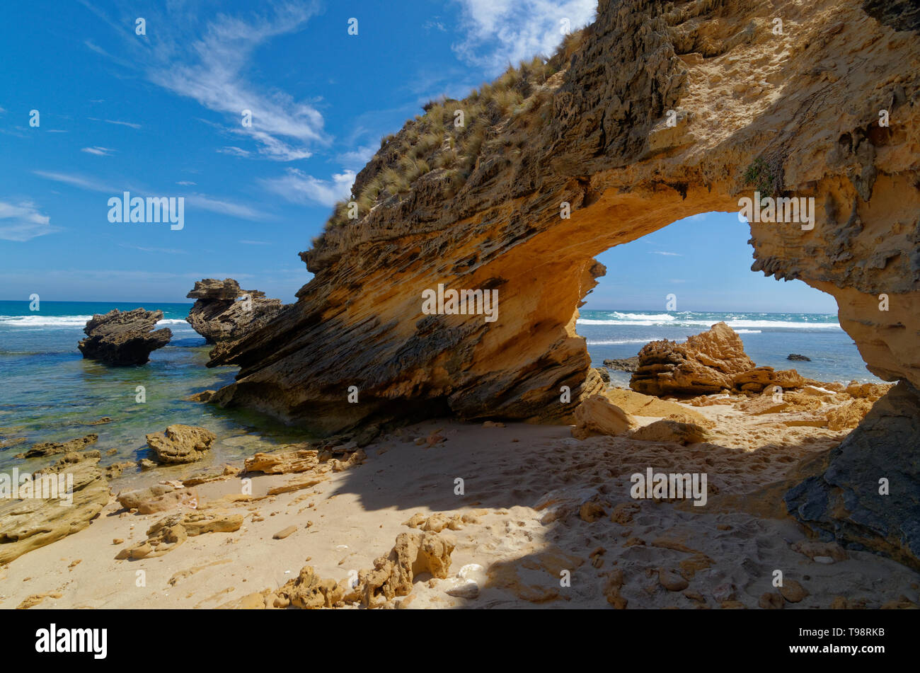 Rock arch on St Paul's Beach near Sorrento under a bright blue sky on the Mornington Peninsula, Victoria, Australia Stock Photo