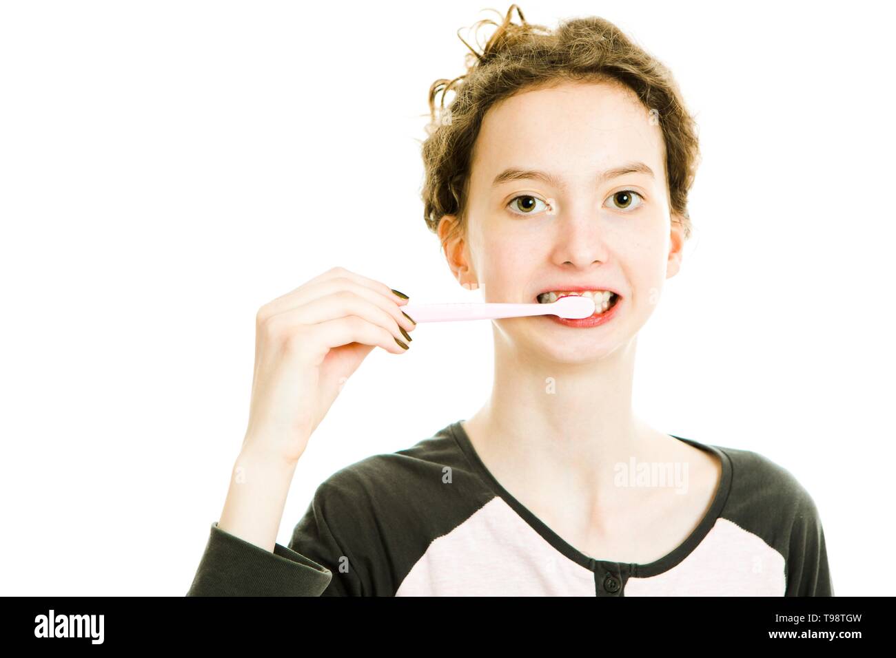 Teen girl brushing teeth, cleaning everyday's routine activity