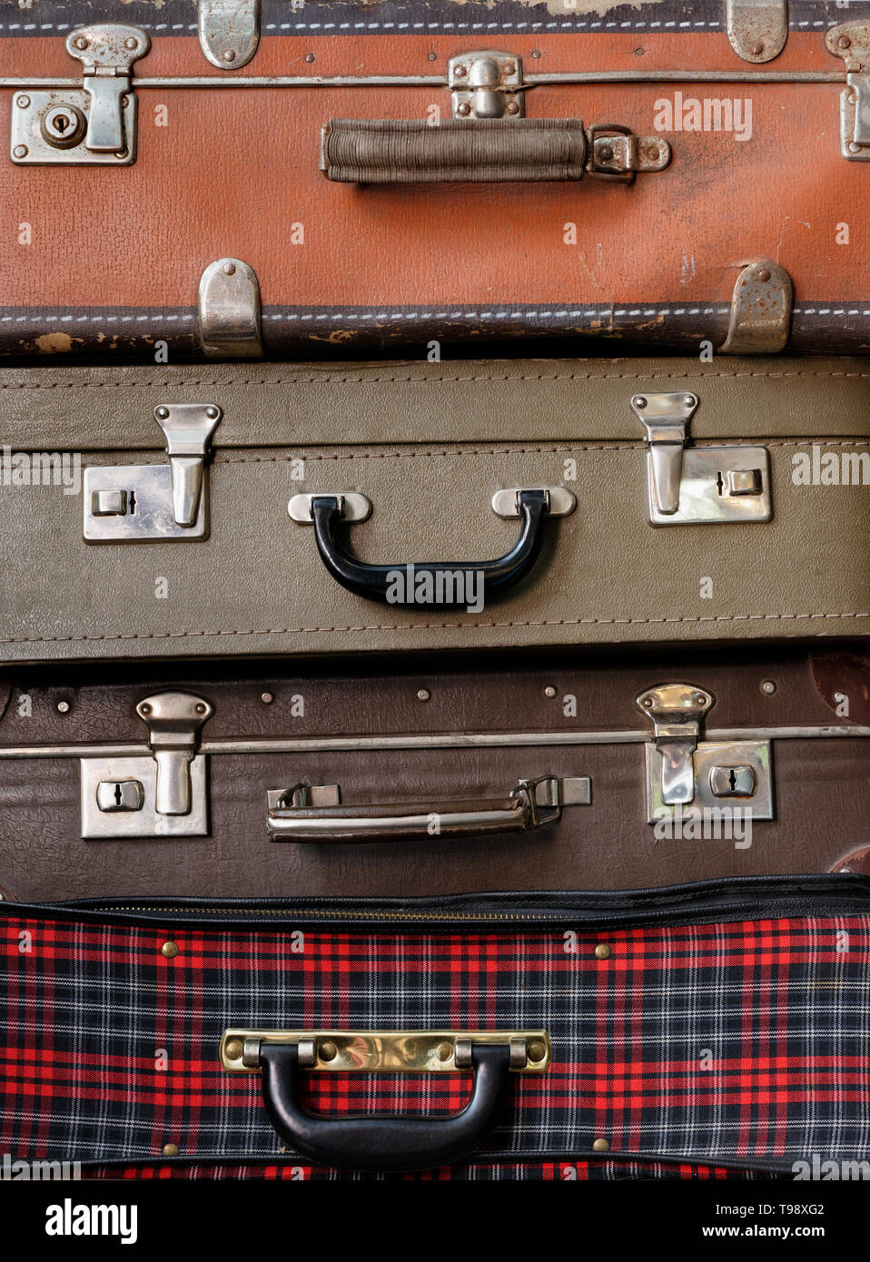 Backgrounds and textures: various stacked old luggage bags Stock Photo