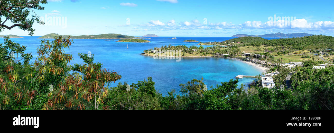 Panoramic landscape of tropical marine blue lagoon with wild green jungle in the foreground. High resolution Stock Photo