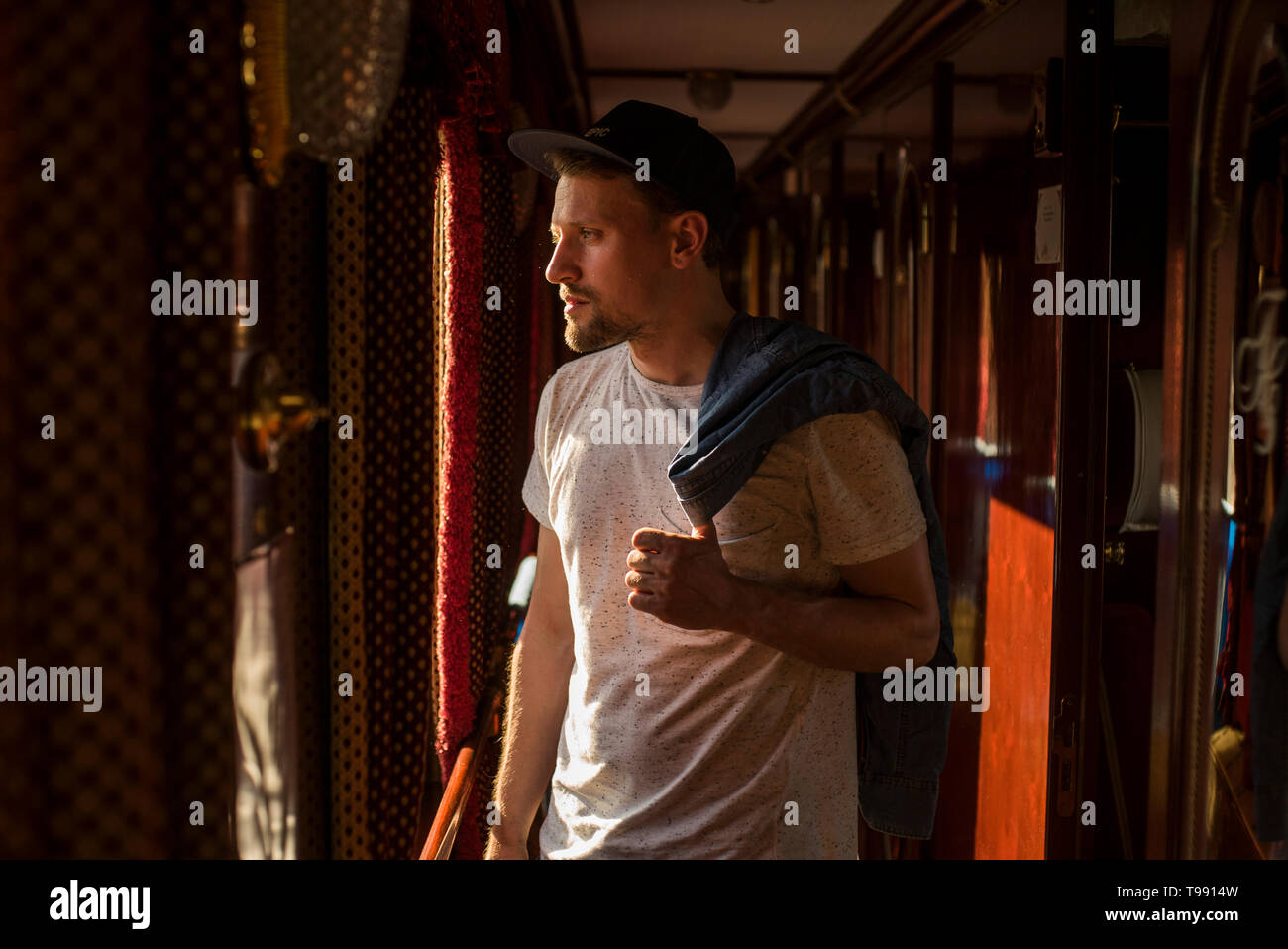 Man standing at window, Trans-Siberian Railroad Stock Photo