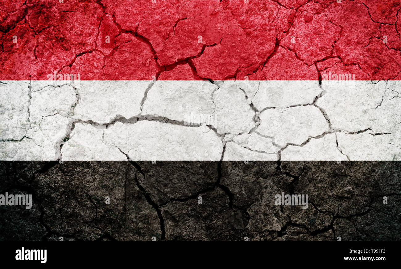 Republic of Yemen flag on dry earth ground texture background Stock ...