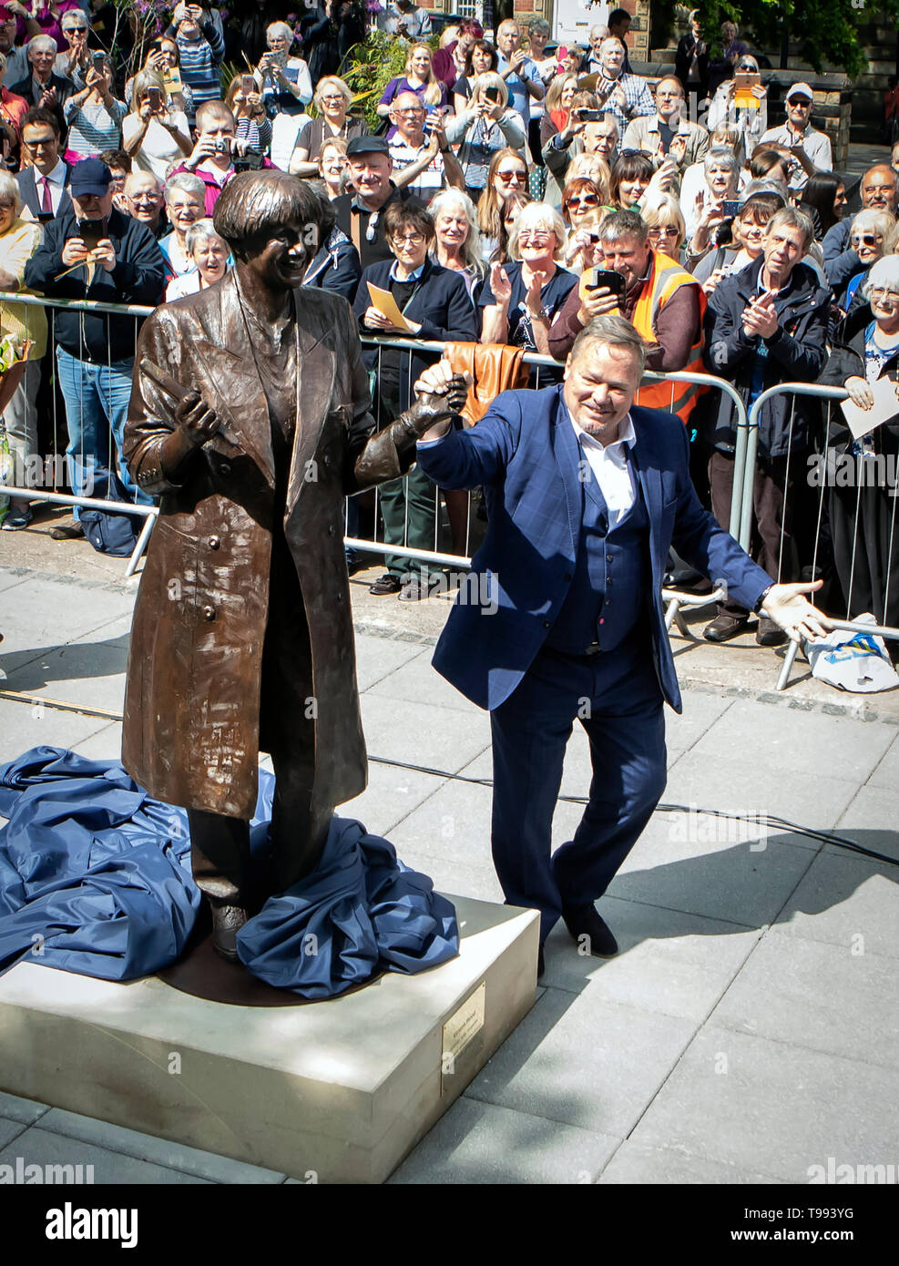 A life-size bronze statue of the late comedian, writer and actor, Victoria Wood is unveiled in Bury town centre by comedian Ted Robbins. Stock Photo