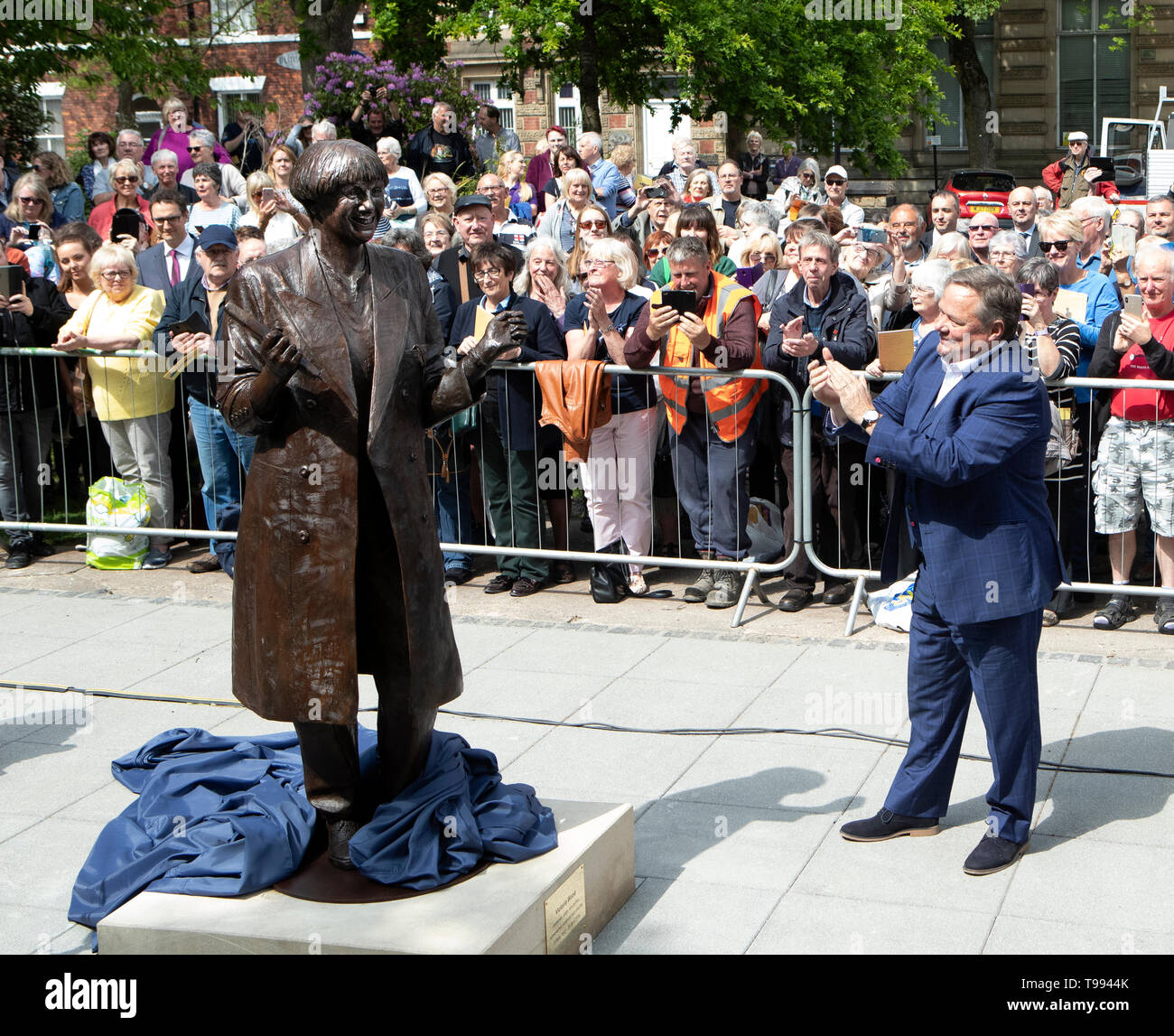A life-size bronze statue of the late comedian, writer and actor, Victoria Wood is unveiled in Bury town centre by comedian Ted Robbins. Stock Photo
