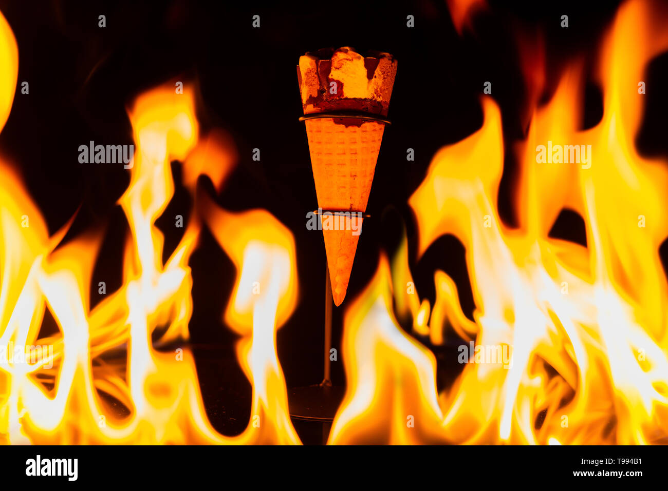 ice cream cone inside fire Stock Photo Alamy