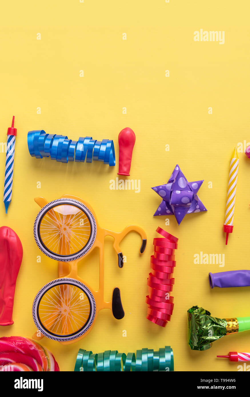 Items for carnival on yellow background. Stock Photo