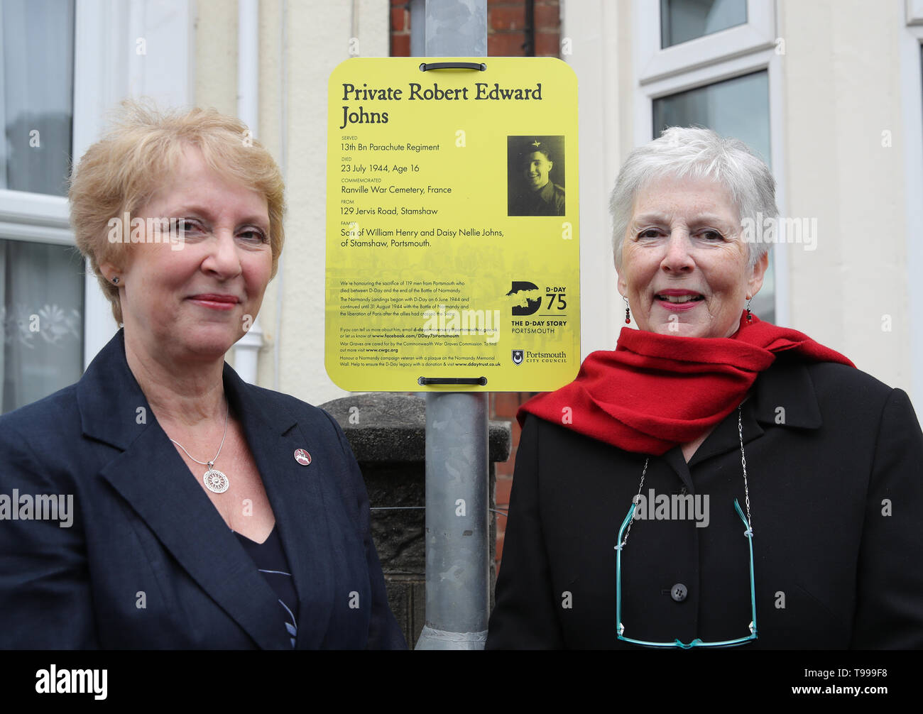 Jenny Ward (left) and Sue Coussy, nieces of Private Robert Edward Johns, pose for a photograph next to his plaque which was unveiled on Jervis Road in Portsmouth, and is part of 119 plaques honouring men from Portsmouth who fought during D-Day. Stock Photo