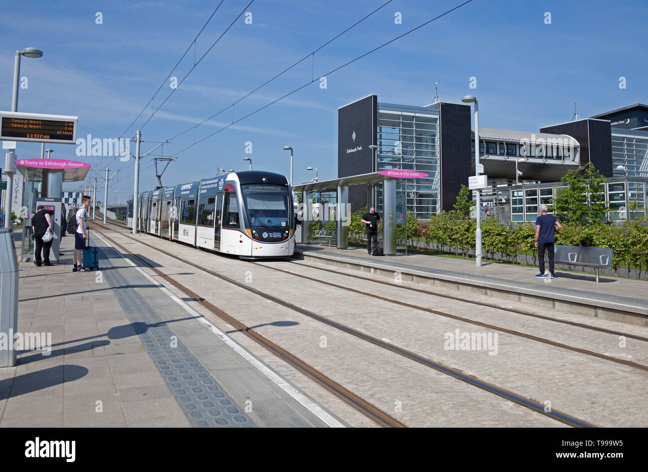 Edinburgh Tram approaching Edinburgh Park stop, Scotland, UK Stock