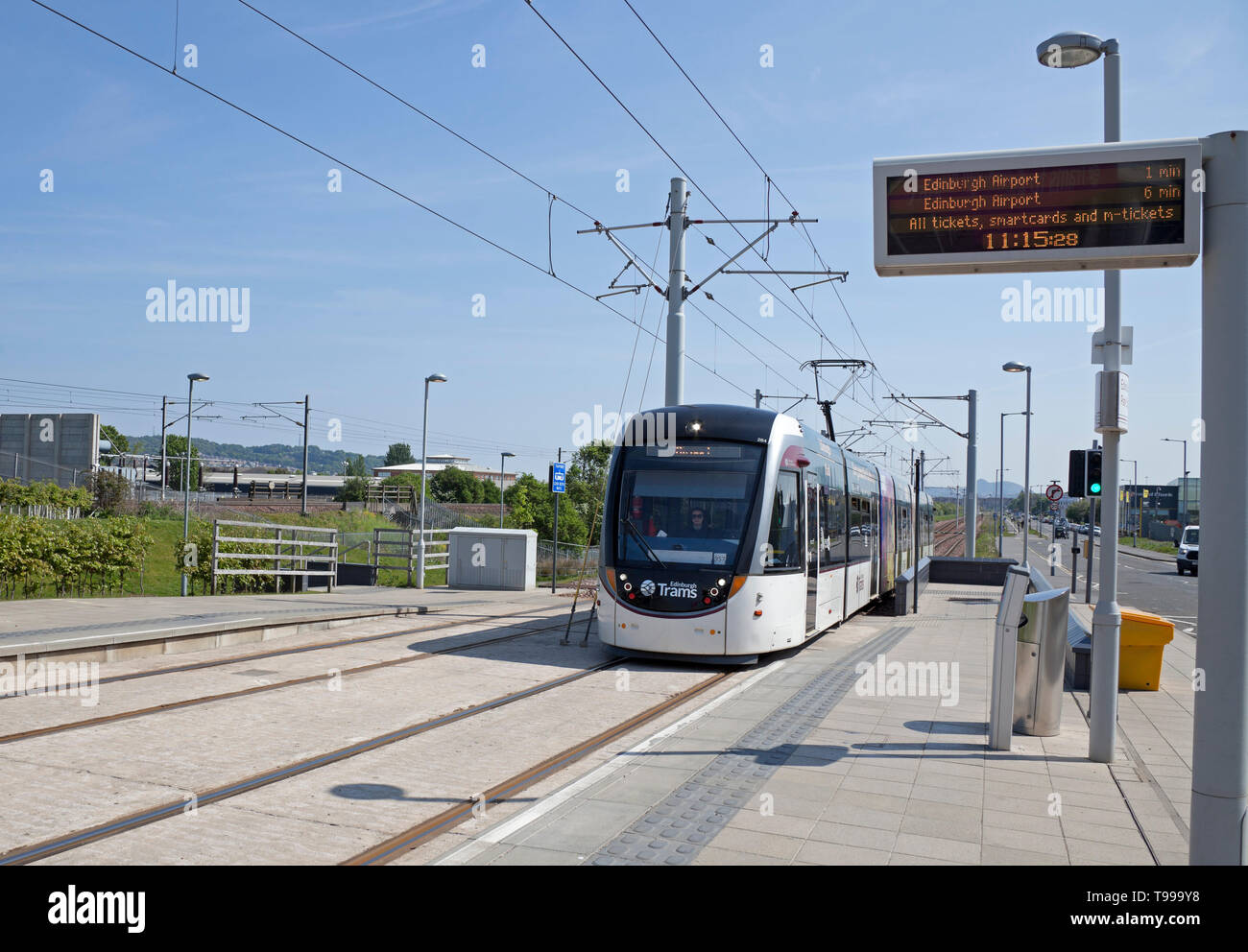 Edinburgh Tram approaching Edinburgh Park stop, Scotland, UK Stock