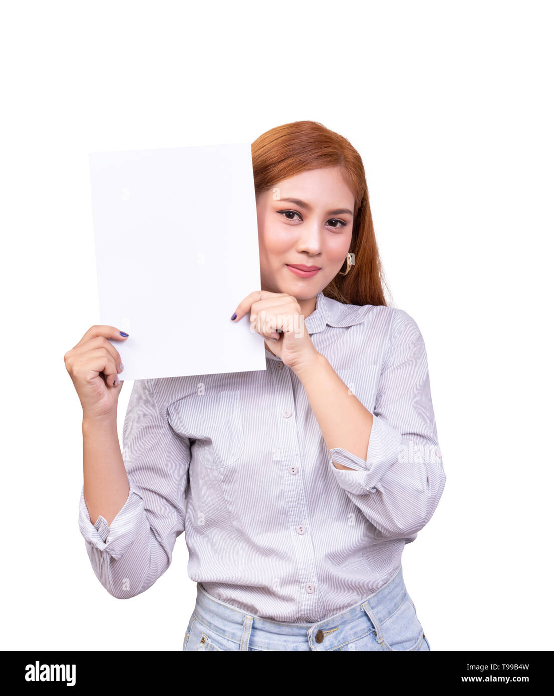 smiling Asian woman holding blank white banner, business sign board  paper with clipping path. studio portrait of beautiful female model with long hai Stock Photo