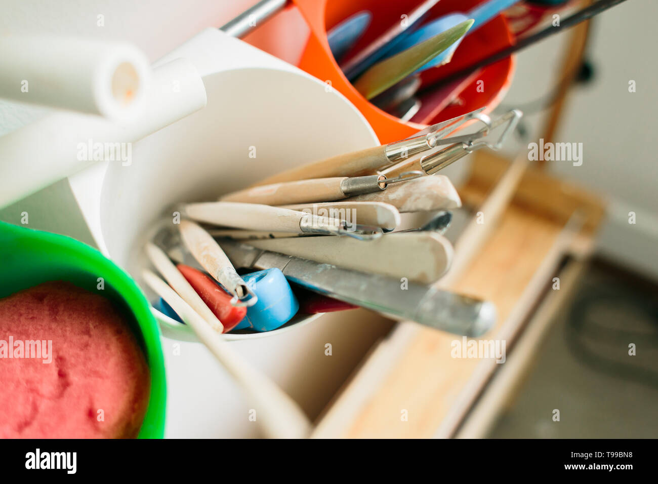 pottery tools for carving ceramic products in workshop Stock Photo