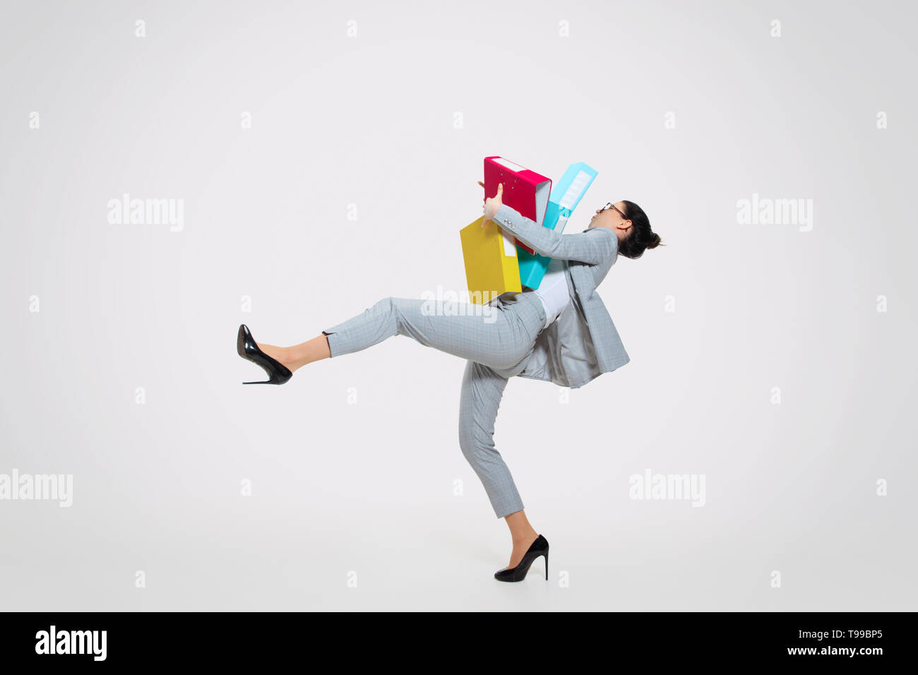 Work Dropping Woman dropping folders hi-res stock photography and images - Alamy