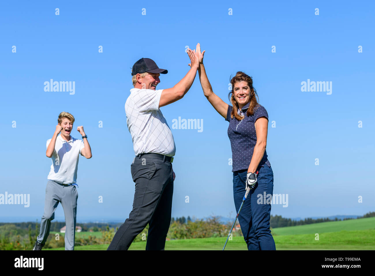 Give me five after perfect putt Stock Photo