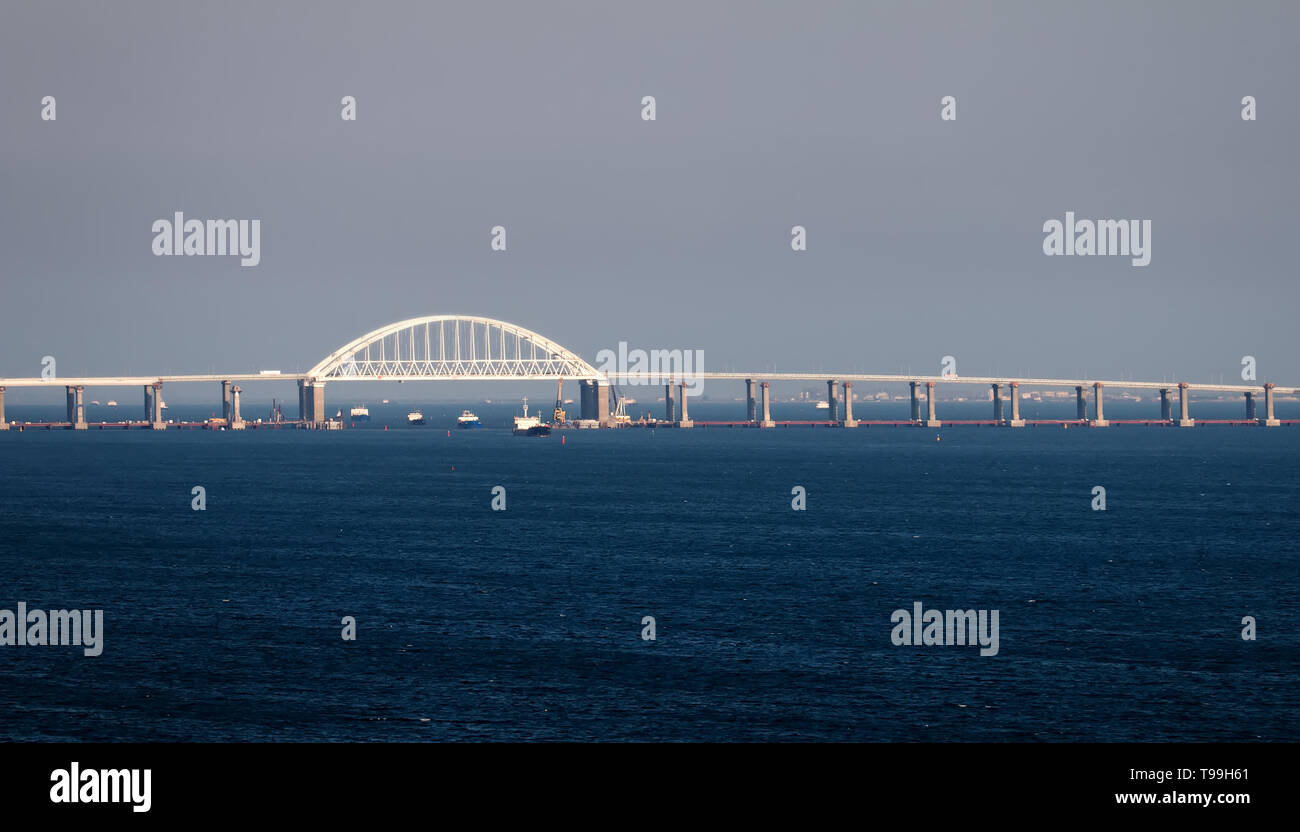 Crimean bridge road across Kerch Strait with leading cargo ships Stock Photo