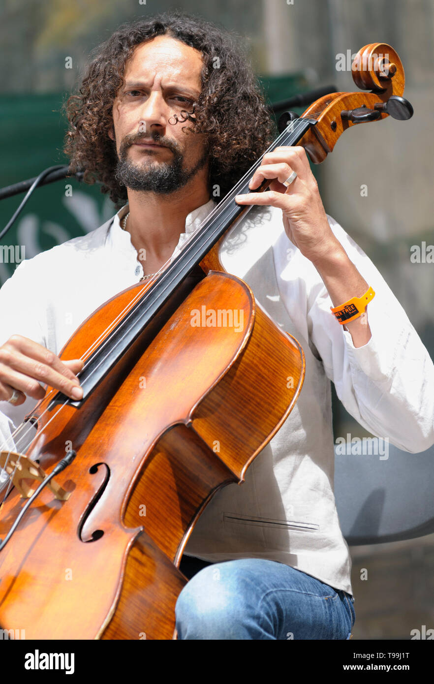 Cellist  Ivan Hussey of Celloman performing at the Larmer Tree Festival, UK. July 18, 2014 Stock Photo