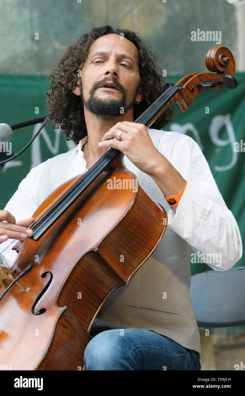 Cellist  Ivan Hussey of Celloman performing at the Larmer Tree Festival, UK. July 18, 2014 Stock Photo