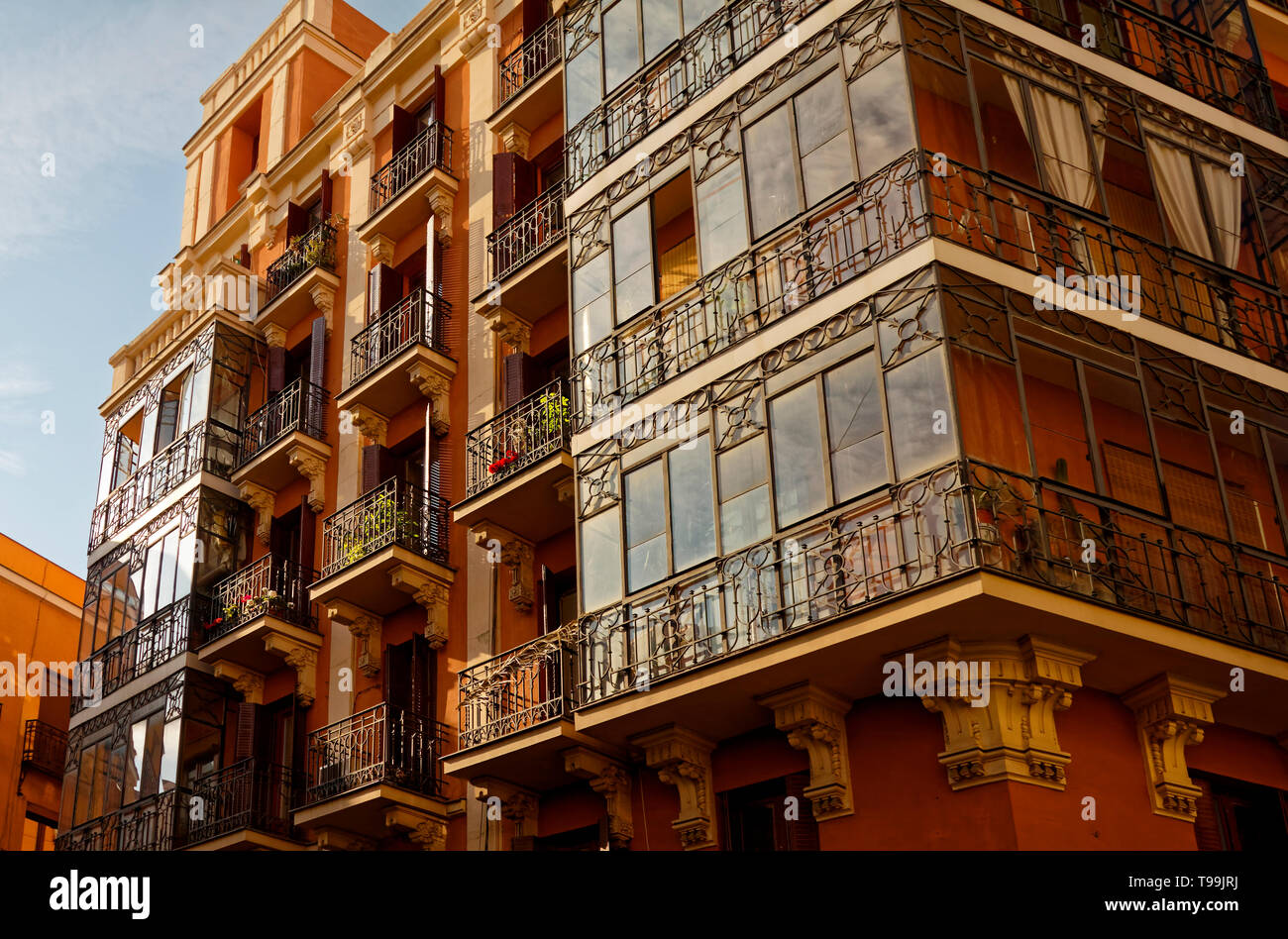apartment building, iron balconies, glass enclosures, attractive
