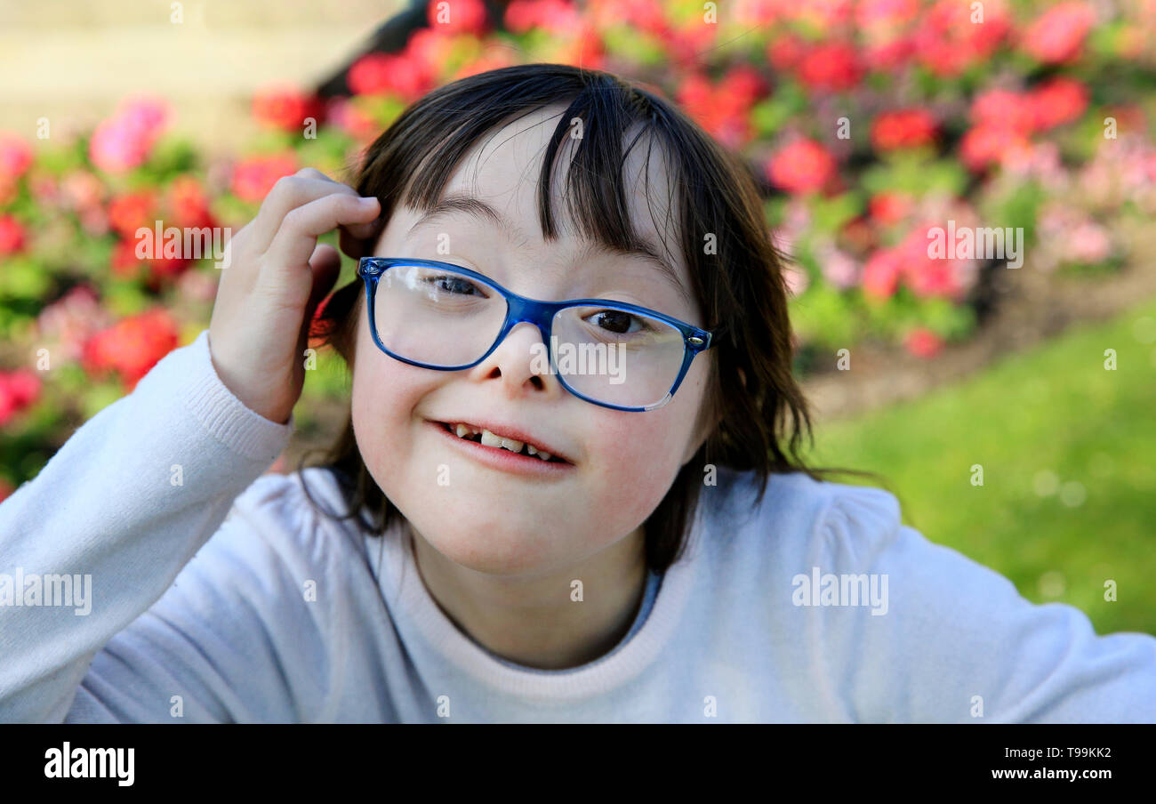 Portrait of little girl smiling outside Stock Photo - Alamy