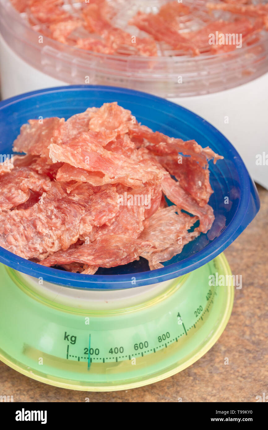 Dried meat 200 grams lies on plastic scales Stock Photo Alamy