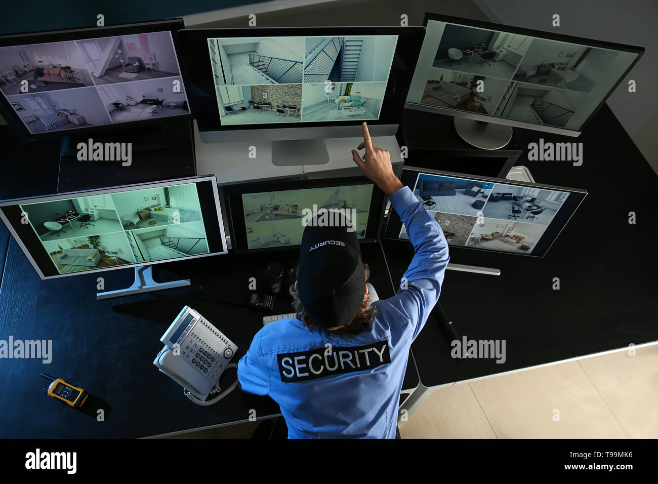 Security guard monitoring modern CCTV cameras in surveillance room Stock  Photo - Alamy