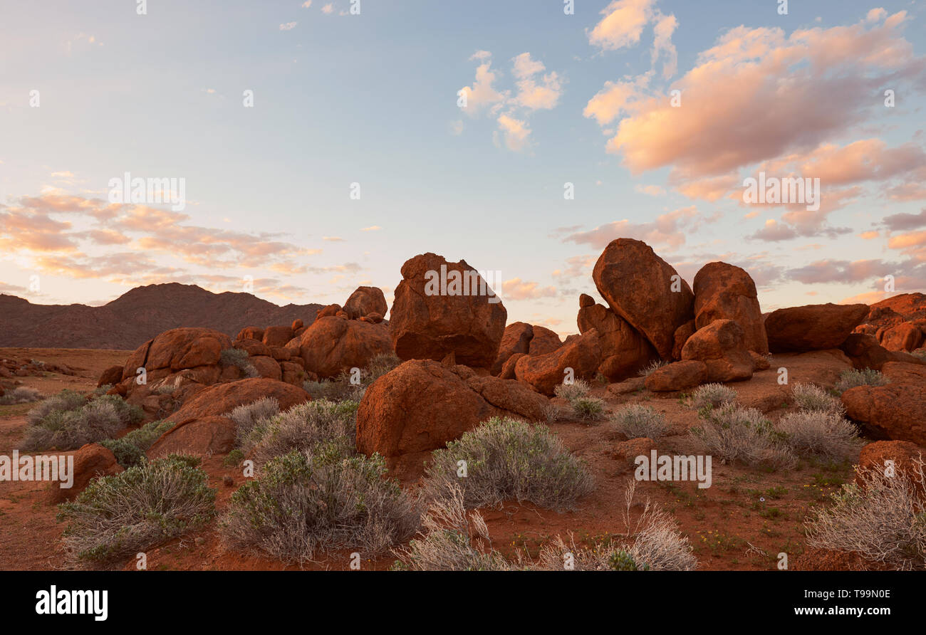 Namibian sunset landscape with big red rocks Stock Photo - Alamy