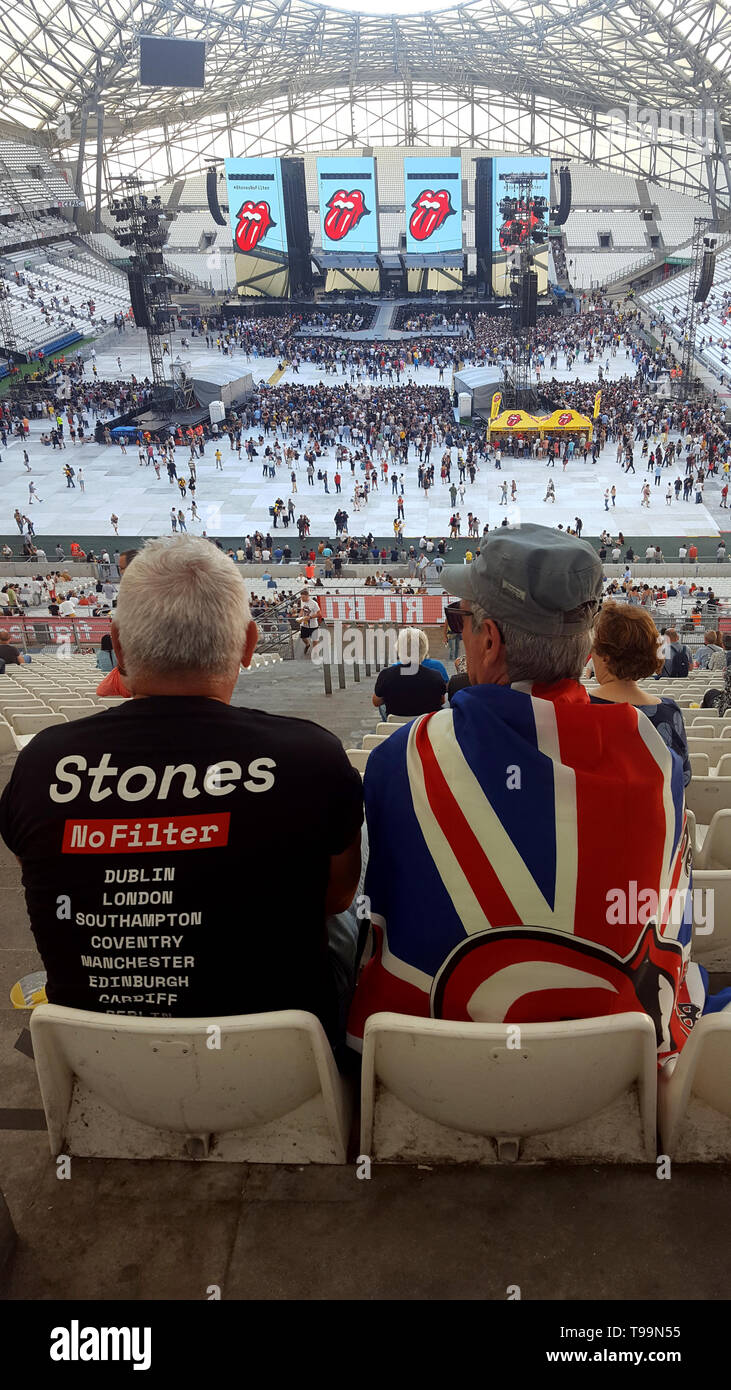 Rolling Stones Rock Music Fans, one Draped with the Union Jack Flag, wait the Start of a Concert by the Rolling Stones during the Legendary Group's No Filter Tour in the Velodrome Stadium Marseille (26 June 2018) Stock Photo