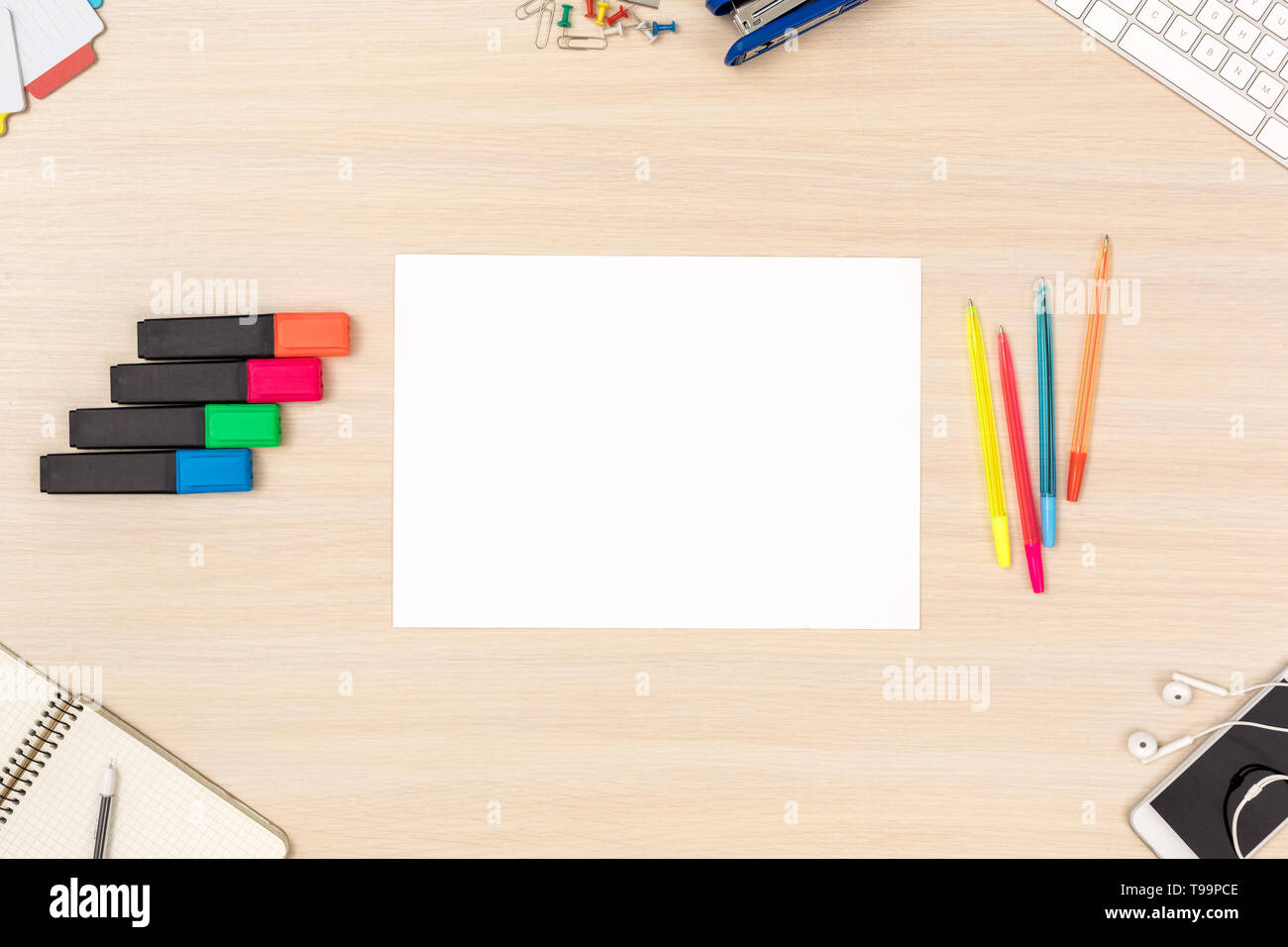 Wooden desk workplace top view nobody sheet of a4 paper color